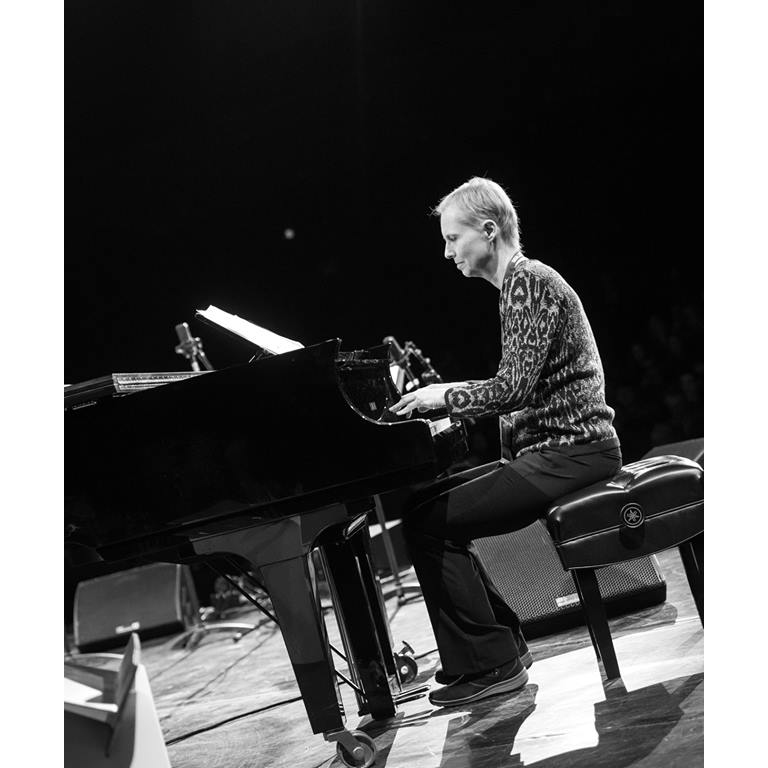 Monika Herzig playing the piano